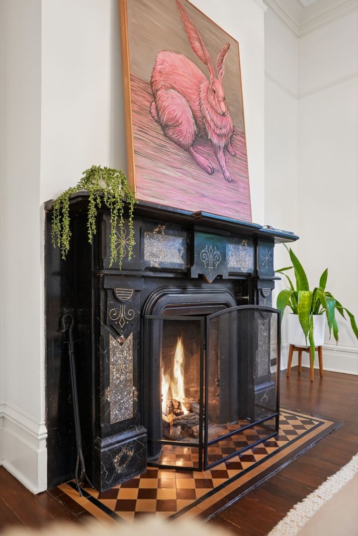 One of three fireplaces, cast iron with the fire going