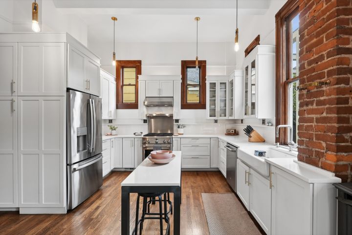 The remodeled kitchen: quartz counters and exposed brick