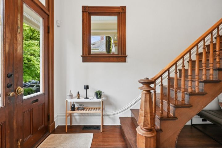 The entry and grand staircase, original to the home