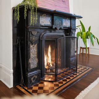 One of three fireplaces, cast iron with the fire going