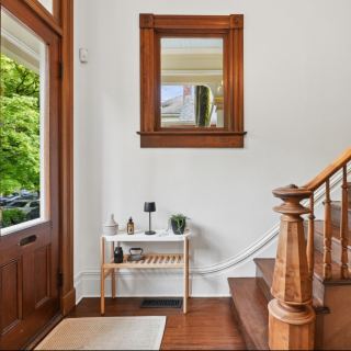 The entry and grand staircase, original to the home